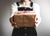 Person holding a Christmas Present (Photo by Kira auf der Heide)