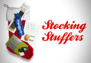 Gloves in a bottle, pencils, and a gift note laying on top of a red and white stocking 